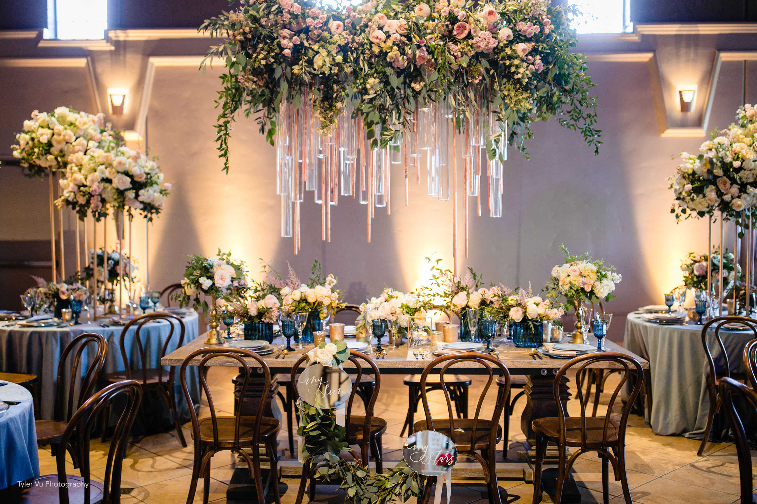 Decadent peach and cream wedding reception design with floral chandelier at Casa Real at Ruby Hill Winery (www.casarealevents.com).  Photo by: Tyler Vu Photography; Florals and Design: Nicole Ha Design; Tabletop and Chair Rentals: Pleasanton Rentals